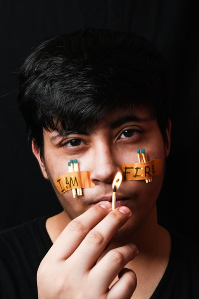 Men face painted yellow and orange pigment
